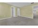 Large bedroom with neutral walls and carpet flooring at 2655 Trafalgar Blvd, Kissimmee, FL 34758