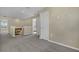 Upstairs hallway with neutral carpeting and doors to bedrooms at 2655 Trafalgar Blvd, Kissimmee, FL 34758