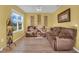 Living room with hardwood floors and brown couches at 2655 Trafalgar Blvd, Kissimmee, FL 34758