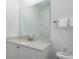 Bathroom with vanity and large mirror at 2904 On The Rocks Pt, Kissimmee, FL 34747