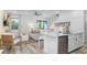 Open kitchen with white cabinets and island at 2904 On The Rocks Pt, Kissimmee, FL 34747