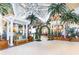 Inviting lobby entrance with tropical decor and a swing at 2904 On The Rocks Pt, Kissimmee, FL 34747