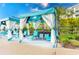 Luxury pool cabanas with TVs and comfortable seating at 2904 On The Rocks Pt, Kissimmee, FL 34747