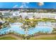 Large resort pool with multiple lounging areas at 2904 On The Rocks Pt, Kissimmee, FL 34747