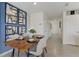 Elegant dining room with wood table and statement wall art at 2909 Hudson Hammock Way, Saint Cloud, FL 34773