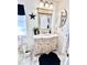 Bathroom with a vanity and a large mirror at 303 Palmview Ct, Kissimmee, FL 34743