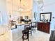 Kitchen with breakfast bar and dark granite countertops at 303 Palmview Ct, Kissimmee, FL 34743