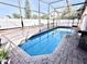 Relaxing screened-in pool area, perfect for outdoor enjoyment at 303 Palmview Ct, Kissimmee, FL 34743