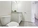 Simple bathroom with granite countertop and toilet at 3092 Prelude Ln, Kissimmee, FL 34746