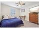 Bright bedroom with ceiling fan and large window at 3092 Prelude Ln, Kissimmee, FL 34746