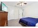 Spacious bedroom with window and bathroom access at 3092 Prelude Ln, Kissimmee, FL 34746