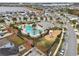 Aerial view of community pool, playground, and homes at 3092 Prelude Ln, Kissimmee, FL 34746