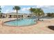 Resort-style pool with lounge chairs and palm trees at 3092 Prelude Ln, Kissimmee, FL 34746