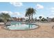 Resort-style pool with lounge chairs and palm trees at 3092 Prelude Ln, Kissimmee, FL 34746