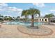 Resort-style pool with lounge chairs and palm trees at 3092 Prelude Ln, Kissimmee, FL 34746