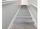 Elegant carpeted staircase leading to upper level at 3092 Prelude Ln, Kissimmee, FL 34746