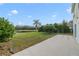 Spacious backyard with a patio overlooking a pond at 3170 Santa Cruz Dr, Kissimmee, FL 34746