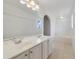 Bright bathroom boasts double sinks, a large soaking tub, and updated fixtures at 3170 Santa Cruz Dr, Kissimmee, FL 34746