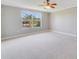 Large bedroom with ceiling fan and carpet flooring at 3170 Santa Cruz Dr, Kissimmee, FL 34746