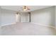 Main bedroom with ceiling fan and carpet flooring at 3170 Santa Cruz Dr, Kissimmee, FL 34746