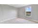 Light and airy bedroom with a window showcasing a lake view at 3170 Santa Cruz Dr, Kissimmee, FL 34746