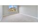 Bedroom with a window offering a view of the surrounding houses at 3170 Santa Cruz Dr, Kissimmee, FL 34746