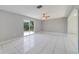 Gathering room with tile floors and sliding glass doors to the backyard at 3170 Santa Cruz Dr, Kissimmee, FL 34746