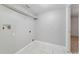 Laundry area with overhead shelving and tile floor at 3170 Santa Cruz Dr, Kissimmee, FL 34746