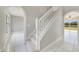 Staircase with white railing leading to the second floor at 3170 Santa Cruz Dr, Kissimmee, FL 34746