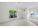 Bright dining room with tile floors and large windows at 3427 Kayla Cir, Oviedo, FL 32765