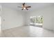 Bright Gathering room with tile floors and sliding doors leading to the pool at 3427 Kayla Cir, Oviedo, FL 32765