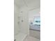 Bathroom with a shower and view into bedroom at 3576 Fort Mellon Ln, Sanford, FL 32773