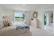 Bright bedroom featuring a large window and stylish decor at 3576 Fort Mellon Ln, Sanford, FL 32773