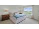 Main bedroom with large window and neutral color palette at 3576 Fort Mellon Ln, Sanford, FL 32773