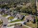 Aerial view of property featuring a well-manicured lawn and a landscaped yard in a Gathering-friendly neighborhood at 381 Skyview Pl, Chuluota, FL 32766