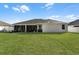 Large backyard with grassy area and house view at 381 Skyview Pl, Chuluota, FL 32766