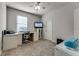 Bedroom featuring a desk with office equipment, tv, and neutral carpet at 381 Skyview Pl, Chuluota, FL 32766