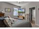 Bedroom featuring a tv and door to the bathroom at 381 Skyview Pl, Chuluota, FL 32766