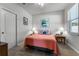 Bedroom featuring neutral carpet, a door to the hallway, and window at 381 Skyview Pl, Chuluota, FL 32766