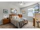 Bedroom featuring a tv, bedside tables, a mirror, and neutral carpet at 381 Skyview Pl, Chuluota, FL 32766