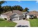 Single-story house with two-car garage and manicured lawn at 381 Skyview Pl, Chuluota, FL 32766