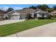 One-story home with a two-car garage, neatly landscaped yard at 381 Skyview Pl, Chuluota, FL 32766