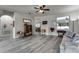 Bright living room featuring hardwood floors and ample natural light at 381 Skyview Pl, Chuluota, FL 32766