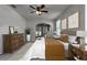 Serene bedroom with a ceiling fan, neutral walls, and a doorway leading to an outdoor area for relaxation at 381 Skyview Pl, Chuluota, FL 32766