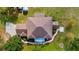 An overhead view showcasing the home's layout, roof, and surrounding landscaped yard at 3943 W Campbell Rd, Lakeland, FL 33810