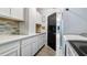 Functional laundry room featuring a sink, countertops, cabinets, stylish backsplash, and washer and dryer at 3943 W Campbell Rd, Lakeland, FL 33810