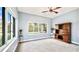 Bright living room boasts large windows and a classic wood hutch at 3943 W Campbell Rd, Lakeland, FL 33810