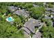 Aerial view of condo community showcasing building location, pool, and lush landscaping at 3992 Radley Ct, Longwood, FL 32779