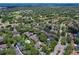 Wide aerial view showing the condo's location in a tree-lined community at 3992 Radley Ct, Longwood, FL 32779