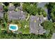 Aerial view highlighting condo building, pool, and surrounding neighborhood at 3992 Radley Ct, Longwood, FL 32779